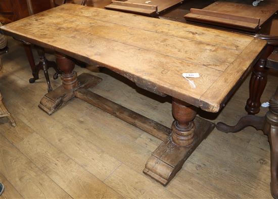 An 18th / 19th century oak rectangular plank top refectory dining table L.183cm
